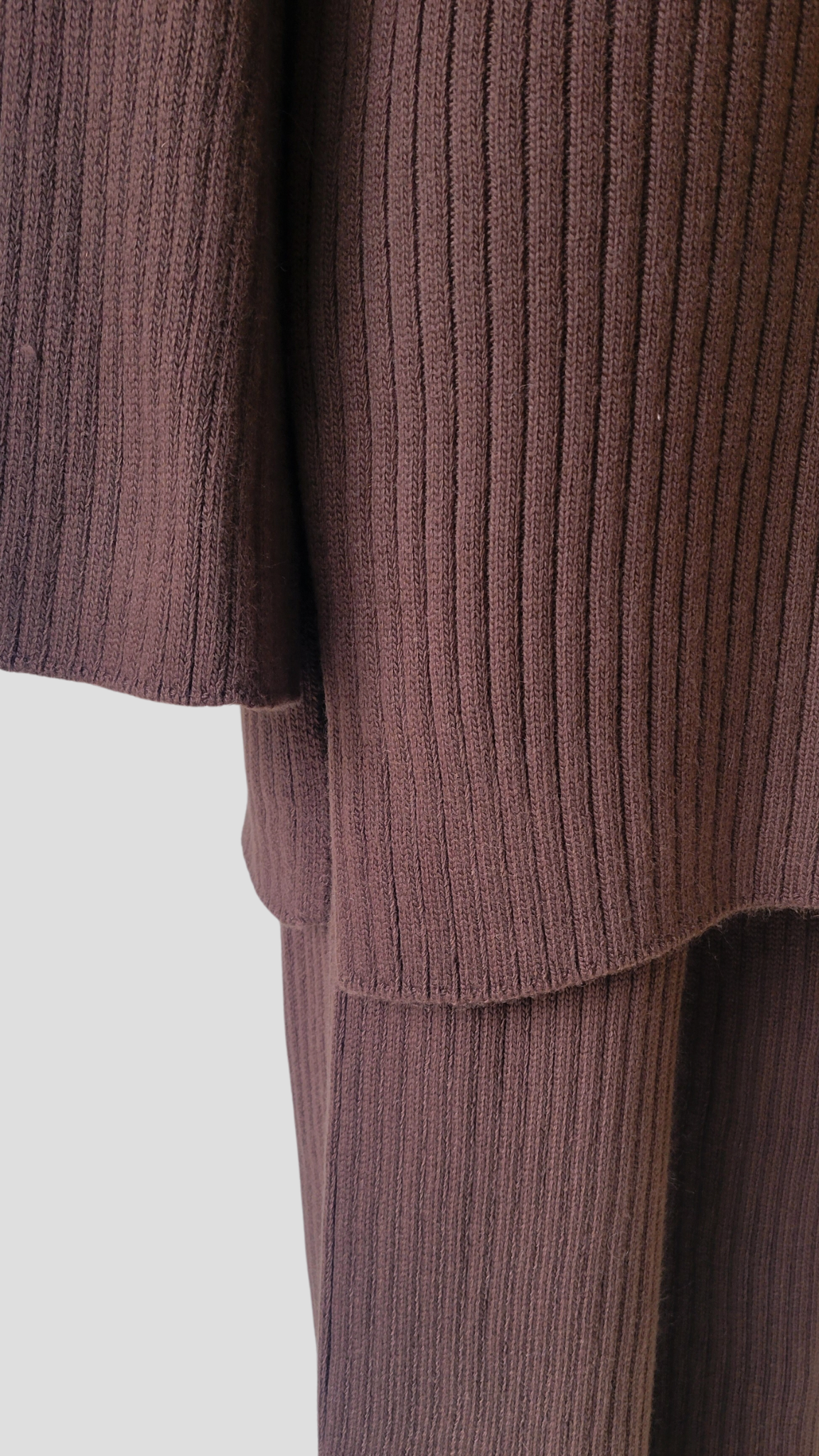 A chic two-piece knit co-ord set in 'Hot Fudge', a dark brown colour. The set includes a comfy sweater with a relaxed fit and matching knit pants. Perfect for a stylish and cozy look.